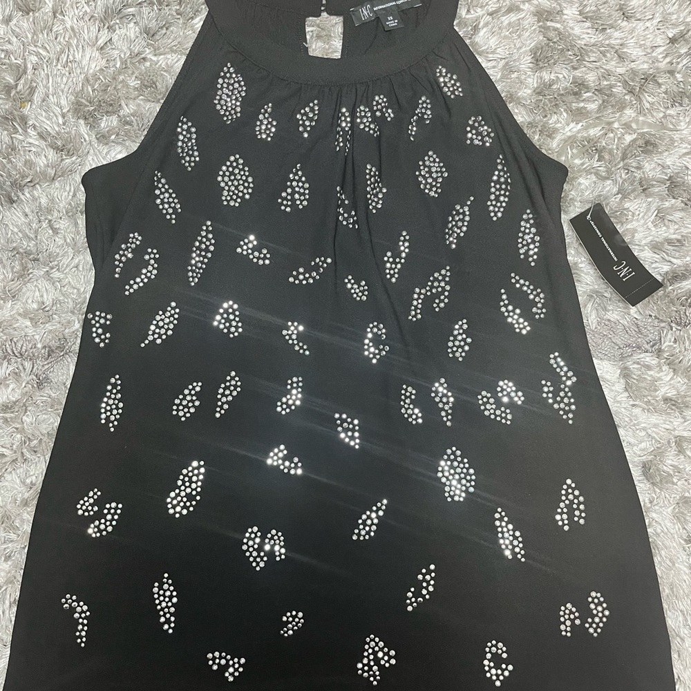 Black Sleeveless Top with Silver Accents